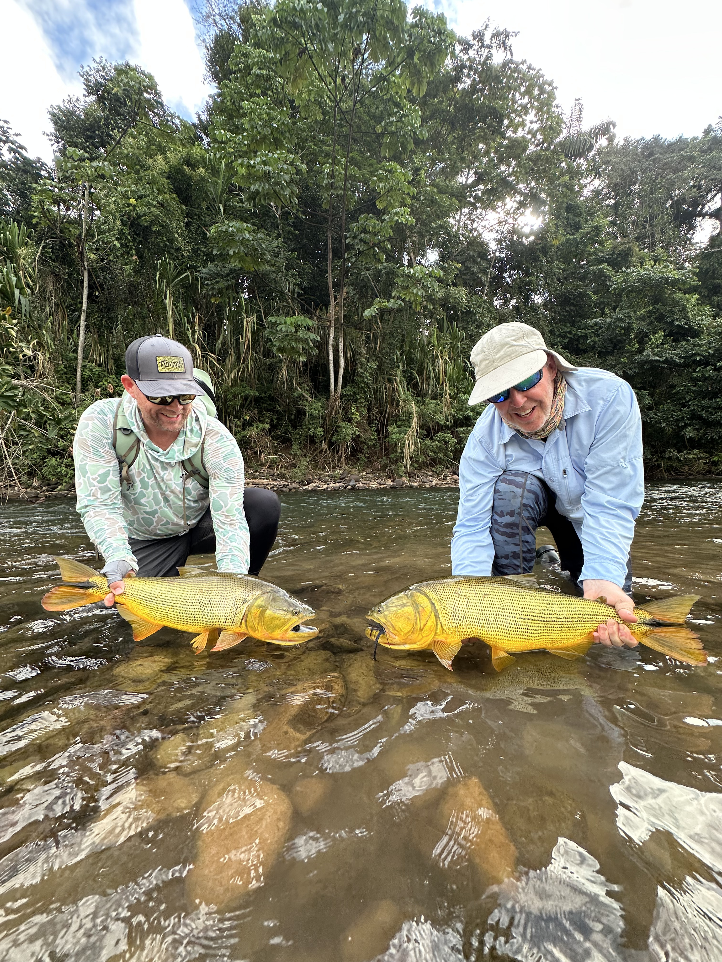 Anglers celebrating another simultaneous dorado hook-up