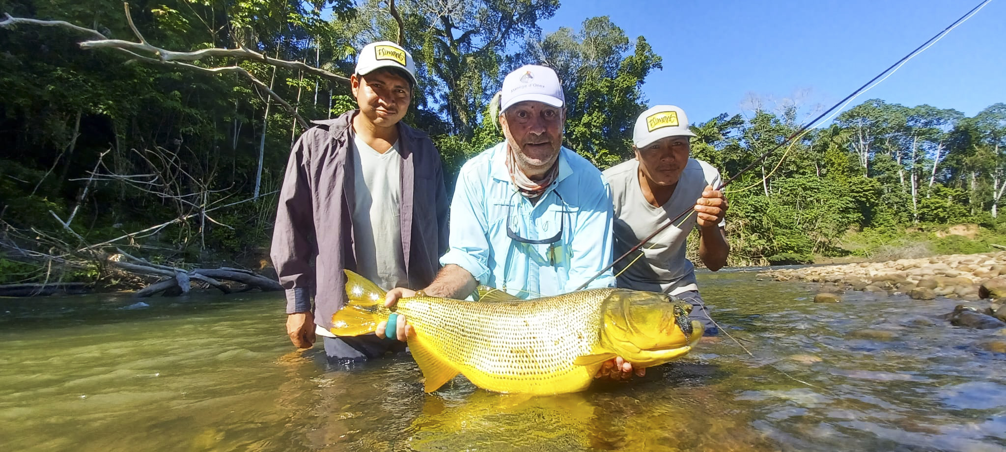 Christopher's exceptional 26-pound female dorado, beached on a narrow sandbar