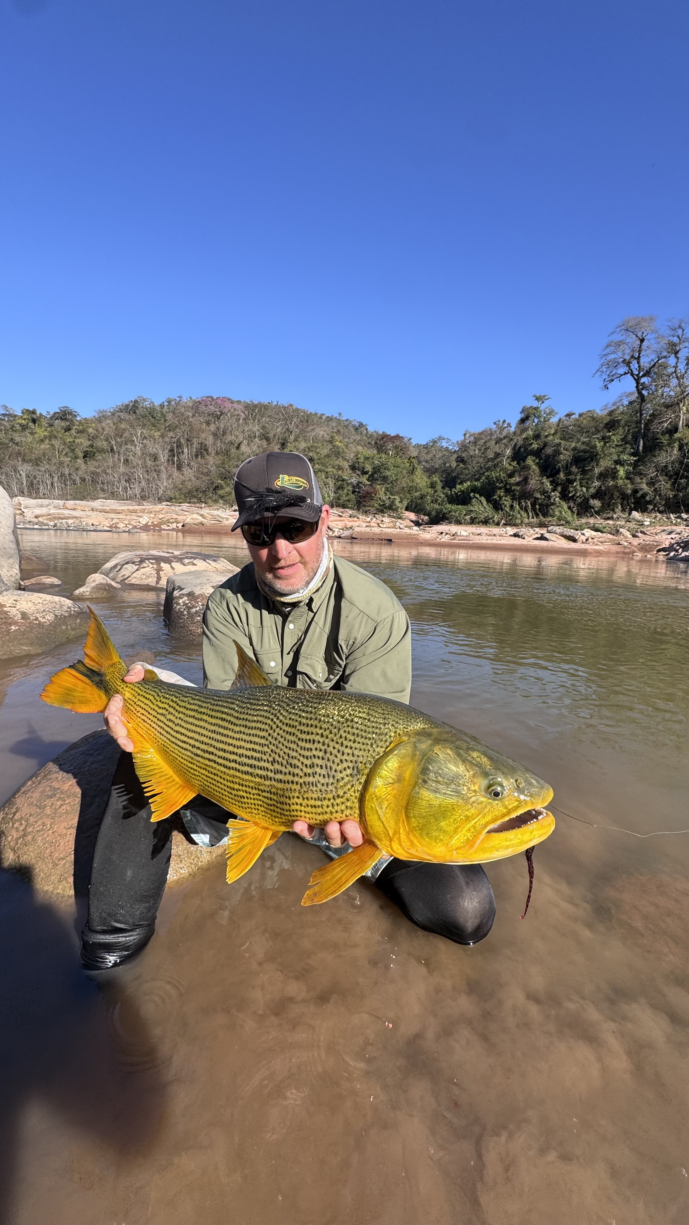 Matt with the fish he found wading in low water