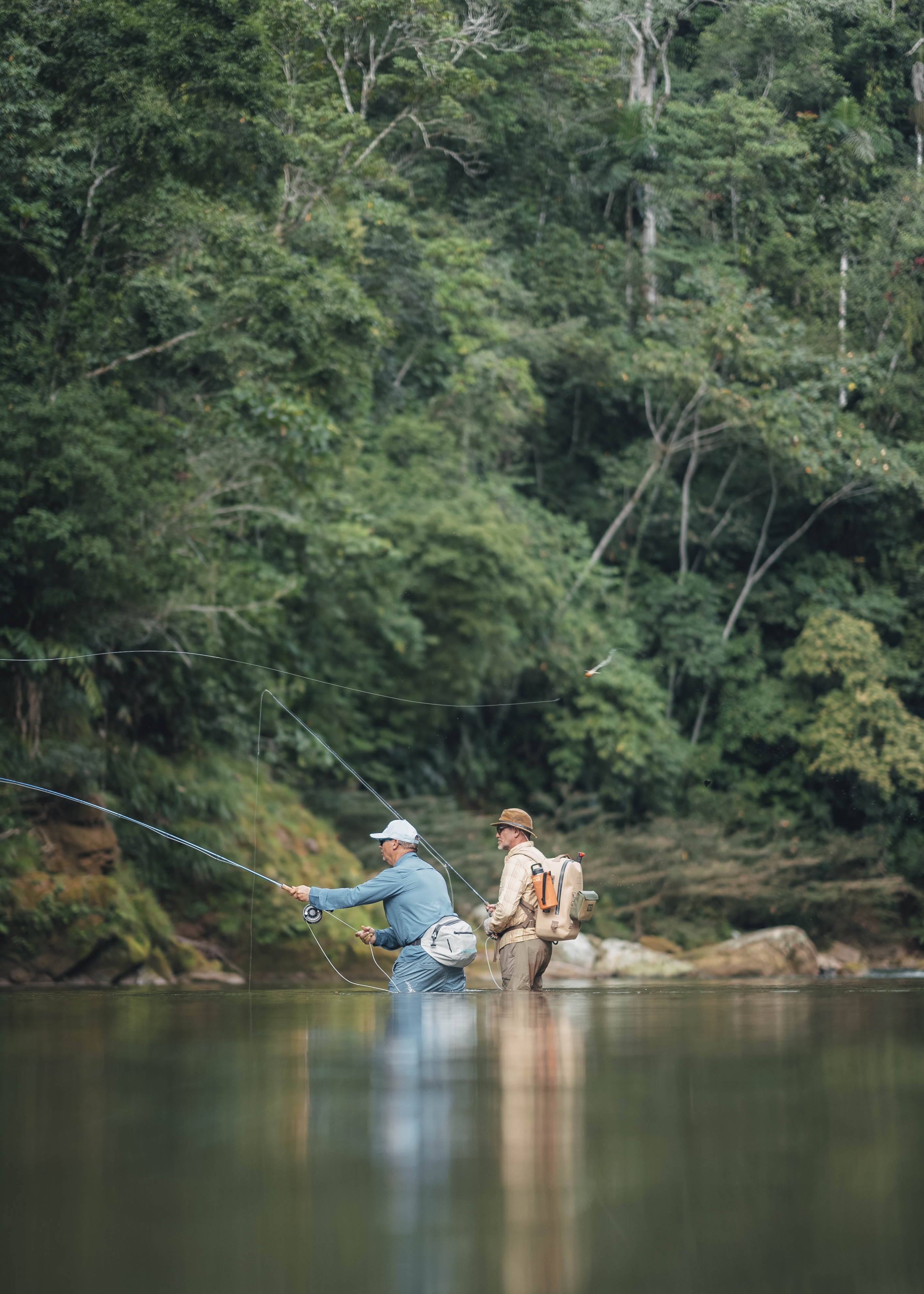 Angler and @jungleangler wading in deep river
